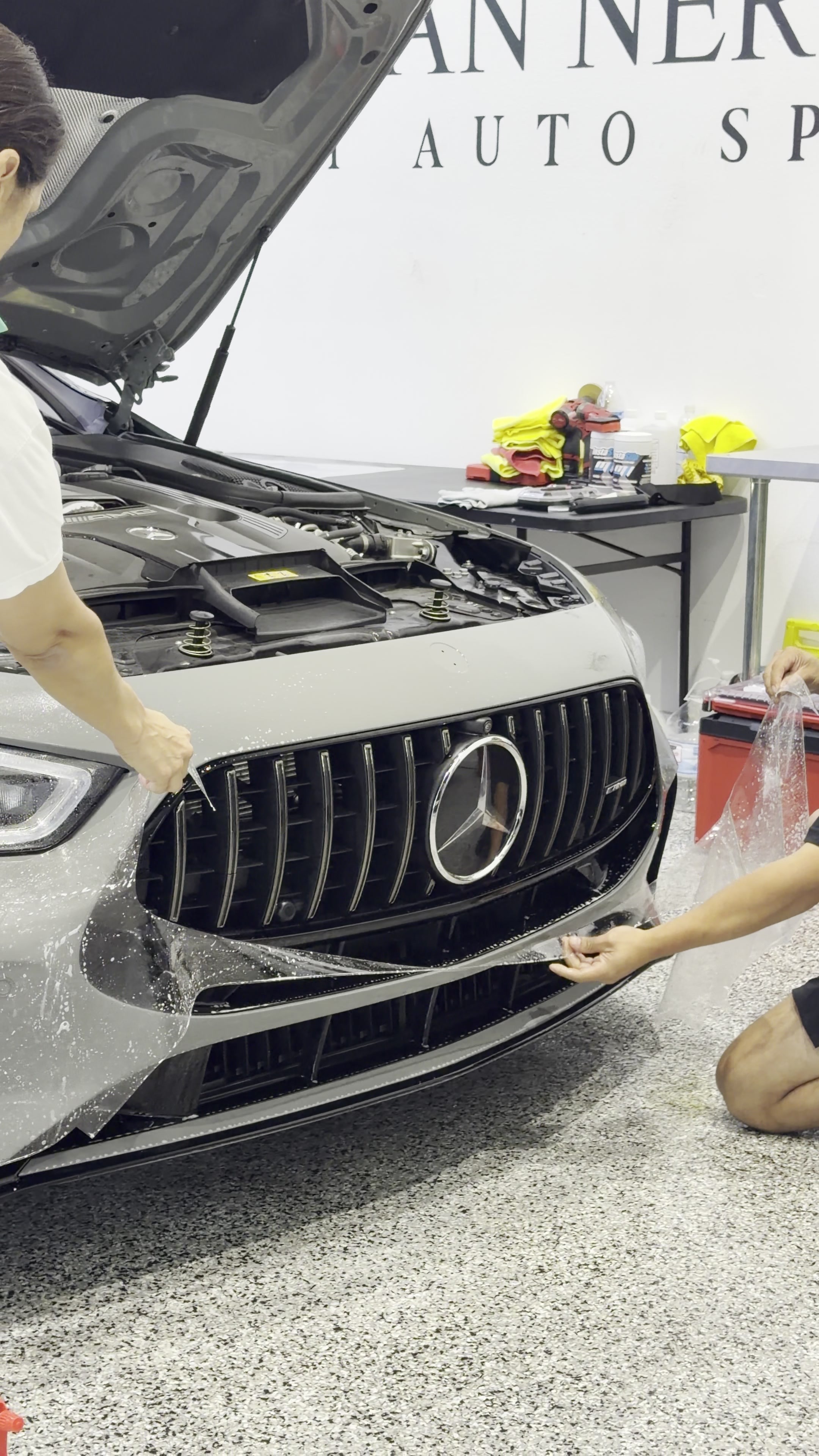 Paint protection film installation on a Mercedes front end